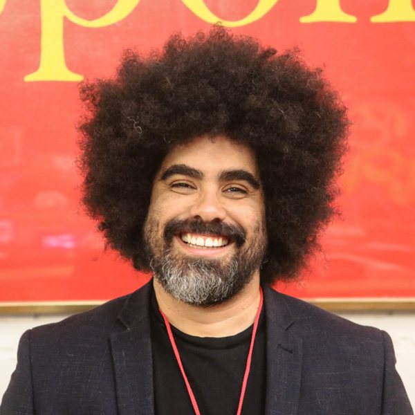 Terence Mentor, smiling, in a dark blazer
